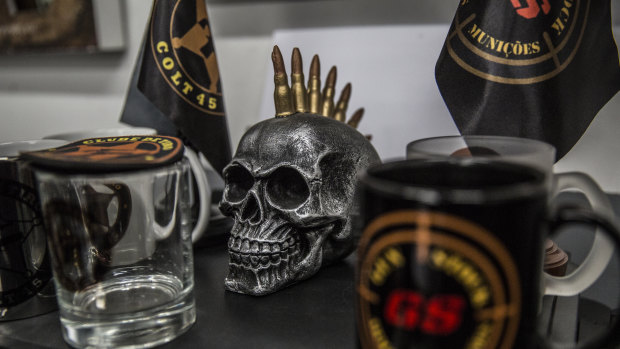A skull sculpture sits next to merchandise at the reception area inside the Colt 45 club in Rio.