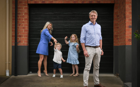 Arron Wood, at home with his wife Stephanie and their children Sam and Addison.