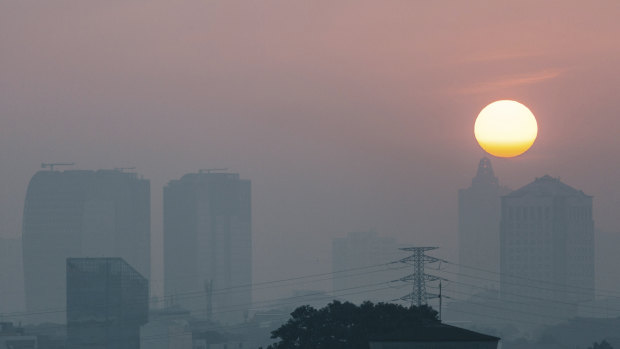 The sun struggles to shine through the Jakarta smog.