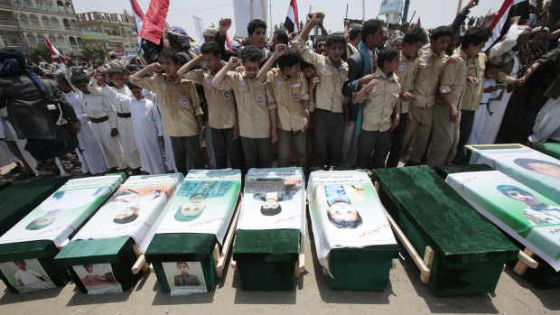 Yemeni people attending the funeral of victims of a Saudi-led airstrike in August.