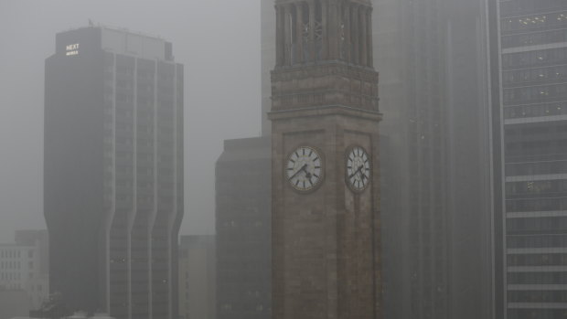 Heavy rain hits Brisbane CBD as storms sweep across south-east Queensland.