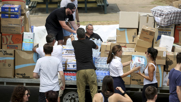 Volunteers prepare donations to be sent to bushfire-affected areas.