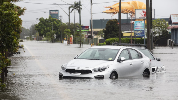 Automatic flood warning signs are being introduced in Brisbane to dissuade drivers from trying to cross flooded streets.