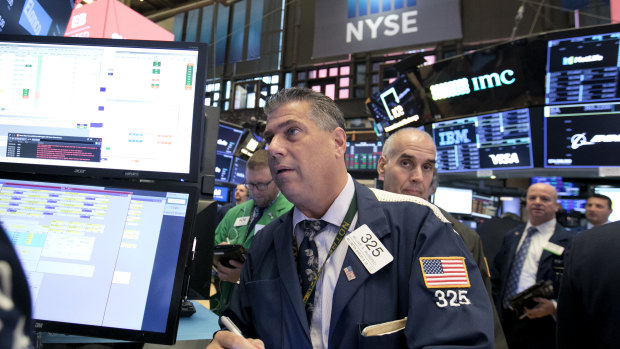 Wall Street finished slightly lower after recovering from a slide early in the day. 
