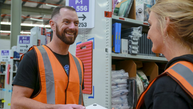 Bendigo Gaming Tech founder Tyler Swann looks at his products on the floor of Amazon's fulfilment centre in Dandenong South. 