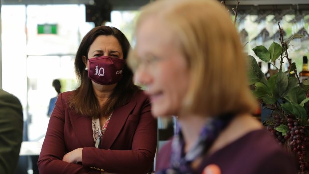 The Premier watches on as Chief Health Officer Jeannette Young delivers a pandemic update.