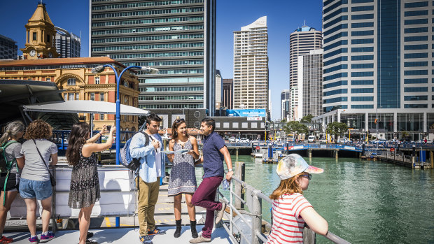 A ferry departs central Auckland, a suburb popular with foreign real estate buyers.