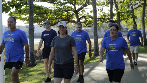 LNP leader Deb Frecklington and Townsville-region candidates walk along the Strand in week one of the campaign.