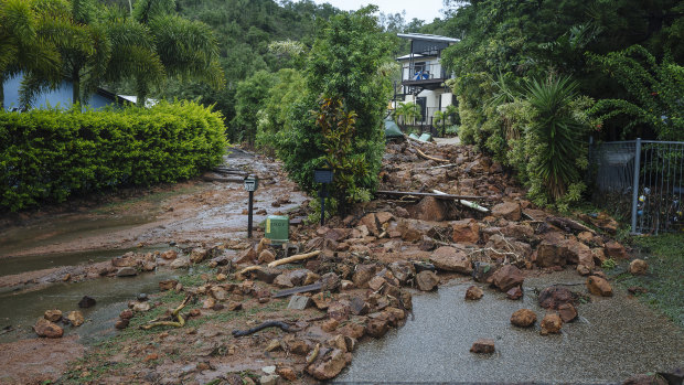 Rocks block Muller Street in Wulguru on Friday after the landslide.