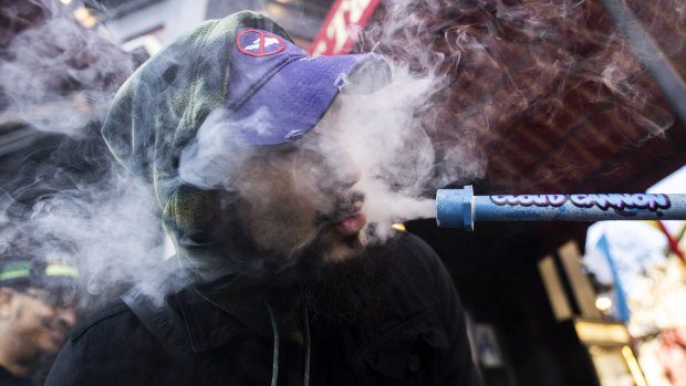 A smoker outside the Smacked pop-up cannabis dispensary in New York. 