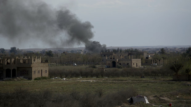 Smoke rises after a strike on Baghouz, Syria, the Islamic State group's last piece of territory.