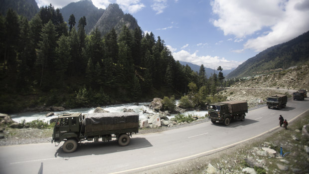 An Indian army convoy moves on the Srinagar-Ladakh highway at Gagangeer, north-east of Srinagar, Indian-controlled Kashmir. 
