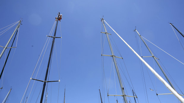 Skyscrapers: the field of masts at the Cruising Yacht Club of Australia, with Michael Spies atop Mark Twain.