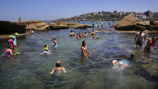 Unseasonably warm: Swimmers enjoy Coogee Beach in January, a scene which may be replicated this weekend.