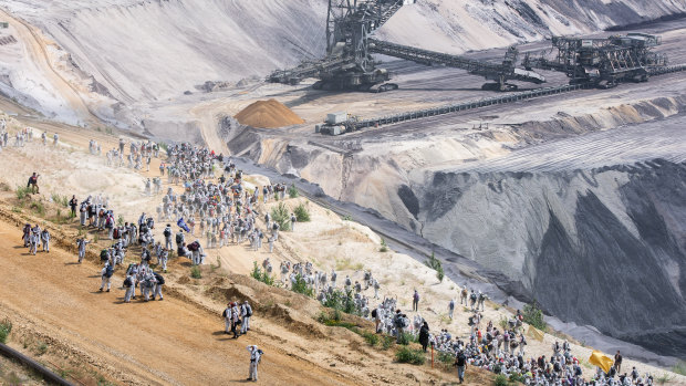 Activists climb into the Garzweiler lignite mine in Germany on June 22 as part of a protest against coal mining.