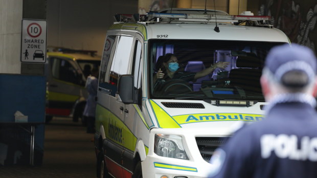 Police at the Westin Hotel direct the ambulances used to ferry evacuees from the Hotel Grand Chancellor.