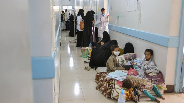 Patients suffering from suspected cholera wait to receive treatment at a hospital in Yemen's capital, Sanaa.