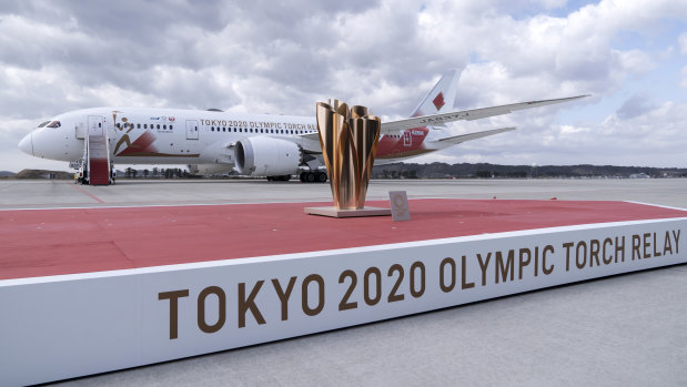 The cauldron on stage in front of the aircraft transporting the Olympic flame at Matsushima Air Base on March 20.