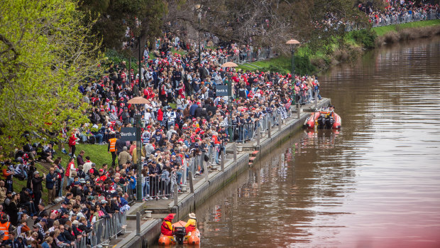 Crowds along the Yarra River for the first grand final parade in Melbourne in three years.