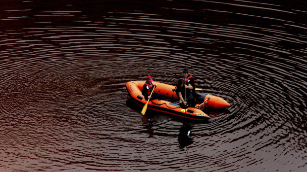 Rescue crews search for suitcases containing the bodies of three women in a toxic mining lake near the village of Mitsero in Cyprus.