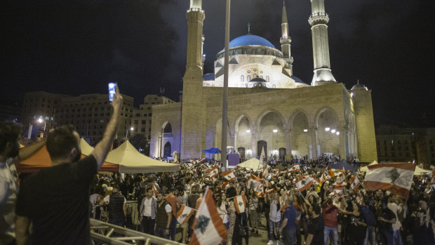 Anti-government protesters wave Lebanese flags in Martyrs' Square on October 29.