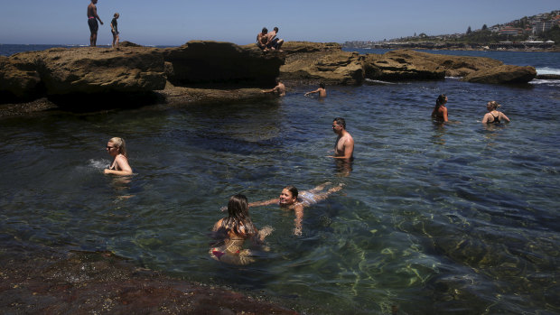 Swimmers cooling off in the Coogee Beach rock pool during a spell of fine weather in Sydney.