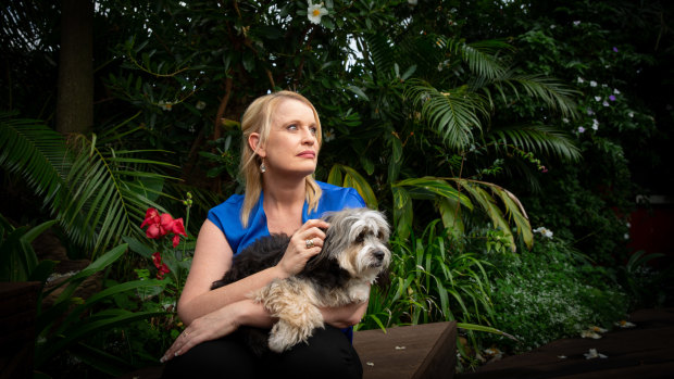 Genny Mathews and her dog Baci at her Gold Coast home.