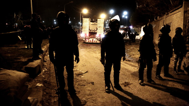 Security forces near the bomb sight, less than four kilometres from the Giza pyramids. 