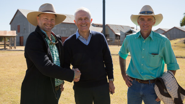 Malcolm Turnbull with Paul Donoley (left) and Bruce  Alexander in the township of Blackall, Queensland on Wednesday.