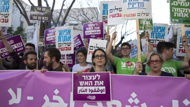 Left wing Israelis hold signs for Gaza as they demonstrate in Tel Aviv, Israel, on Sunday. 