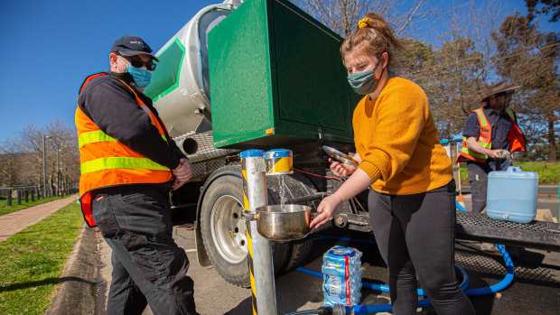 Shanae from Ferntree Gully, collecting clean drinking water from a water tanker.