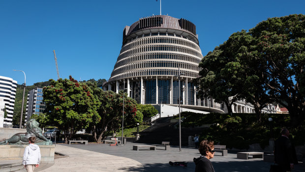 Pedestrians walk past the Parliament Building in Wellington, New Zealand. Few people were in the building at the time of the attack.