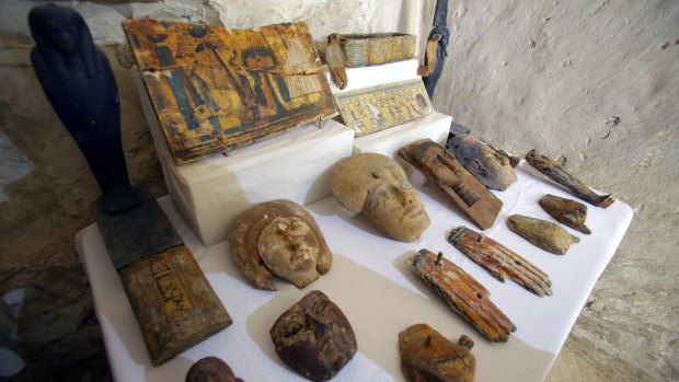 Wooden masks outside the newly discovered tomb at El-Asasef Necropolis, in Luxor.