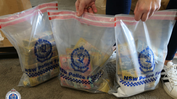 Strike Force Diffey seized cash, firearms and drugs in Merrylands as part of an ongoing investigation into criminals importing methylamphetamine hidden in bottles of hot chili sauce.  