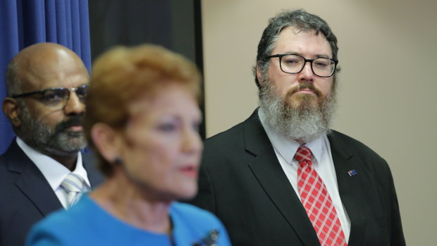 George Christensen looks on as One Nation leader Pauline Hanson announces his Senate candidacy for the party at the 2022 election.