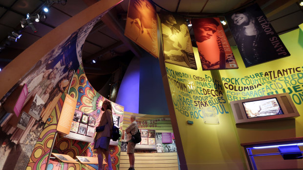 Visitors to the Museum at Bethel Woods view exhibits of the Woodstock Music and Art Fair.