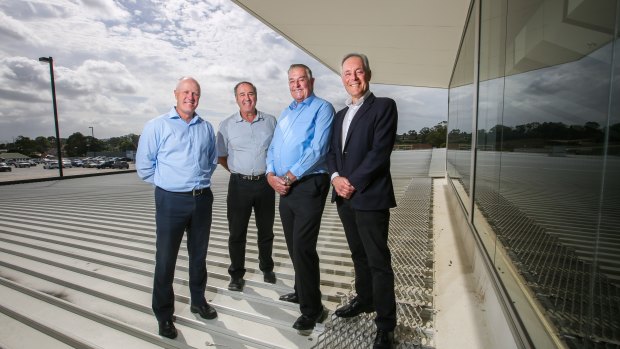 CEP Energy chairman Morris Iemma on the roof of Narellan Town Centre in south-west Sydney with the centre's manager Brad Page, and owners, Arnold Vitocco and Tony Perich.