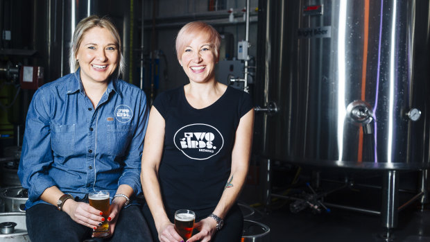 Danielle Allen (left) and Jayne Lewis from Two Birds Brewing have a container of beer headed for China. 