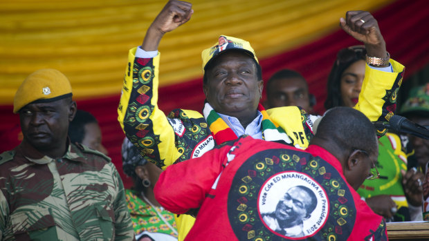 Zimbabwean President Emmerson Mnangagwa addresses the final rally of his campaign at the stadium in Harare, Zimbabwe, on Saturday.