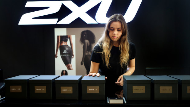2XU shop assistant Cici Lawson preps the new Yeezy range at the 2XU flagship store on the morning of the collection's launch.