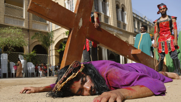 Students re-enact the crucifixion of Jesus Christ to mark Good Friday in Ahmedabad, India.