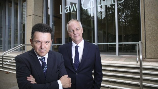 Former senator Nick Xenophon and former ABC foreign correspondent Mark Davis outside the Supreme Court in Sydney.