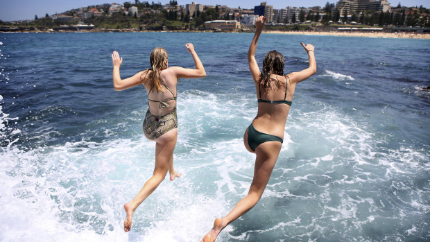 Sunbathers and swimmers  enjoy another hot and sunny day on Tuesday.