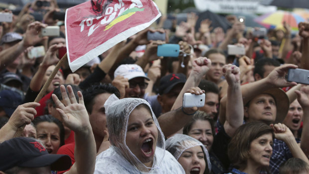 Supporters of Brazil's former president  shout support in Quedas do Iguacu, Parana , on Tuesday.