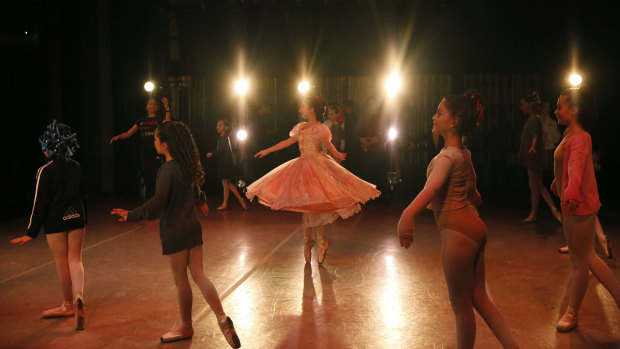 Young dancers, some from Venezuela, perform on stage during a rehearsal of Vladimir Issaev's rendition of The Nutcracker in Fort Lauderdale, Florida.