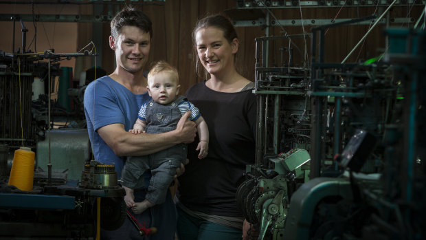 Andrew and Lucy Lindner with their son Arthur, 1, at the family's Crookwell sock-making factory.
