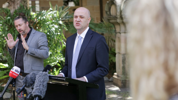 Queensland Chief Health Officer John Gerrard addresses the media in Brisbane.