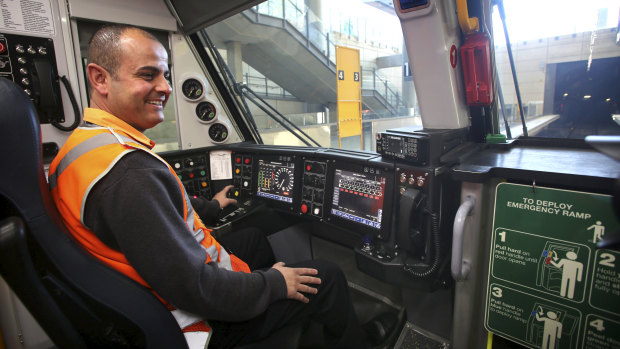 Train driver Adam Ghamrawi at the controls of a new Waratah train at Olympic Park.