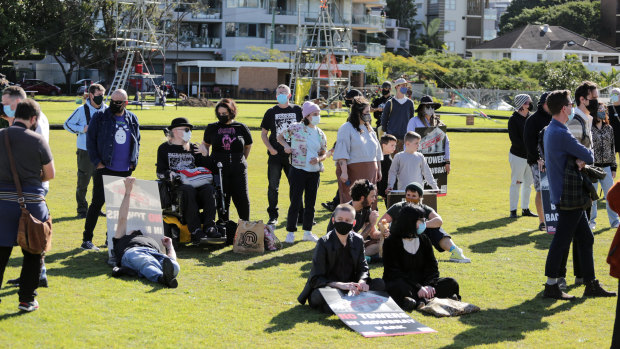 Supporters of Brisbane’s Backbone Youth Arts organisation at a rally urging the council to scrap plans to demolish the East Brisbane Bowls Club.