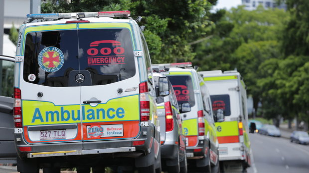 A line of ambulances wait to carry people from the Hotel Grand Chancellor to the site of their extended hotel quarantine stay after concerns about a cluster of the UK COVID-19 strain on the seventh floor.